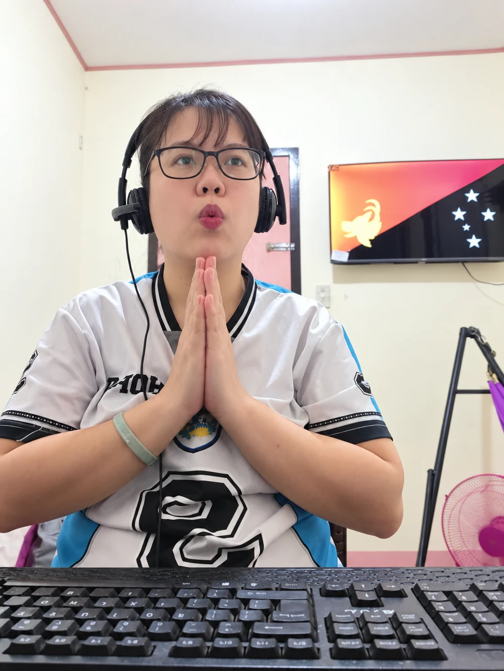 Jeyy Eem sharing a playful moment at her home workspace